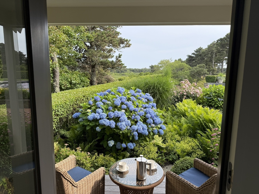 1 Pochick Avenue Nantucket, MA 02554 - Photo 18 of 42 a view of a chair and table in a balcony