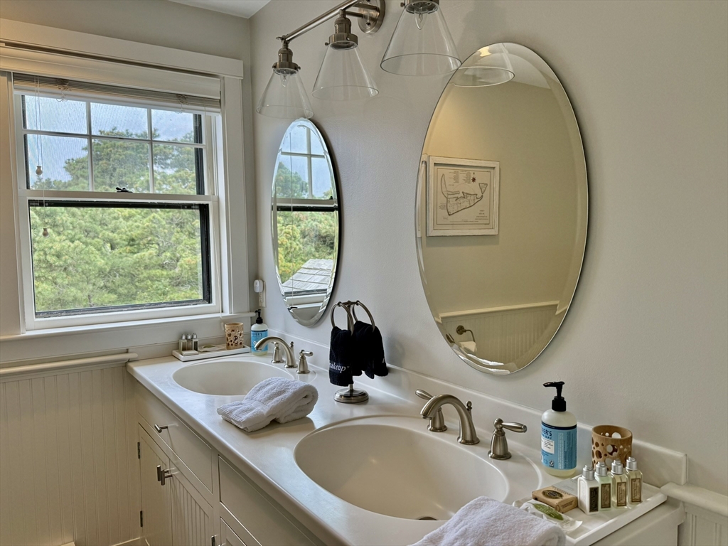 1 Pochick Avenue Nantucket, MA 02554 - Photo 26 of 42 a bathroom with a sink and a mirror