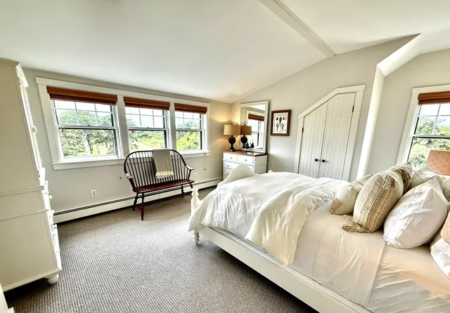 a bed room with a bed and a dresser