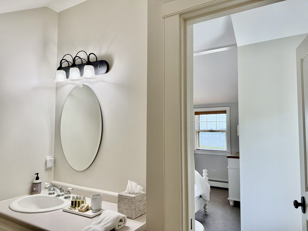 1 Pochick Avenue Nantucket, MA 02554 - Photo 29 of 42 a bathroom with a sink and a mirror