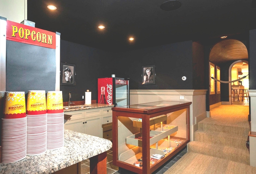 1 Pochick Avenue Nantucket, MA 02554 - Photo 32 of 42 a kitchen with stainless steel appliances kitchen island granite countertop a sink and cabinets