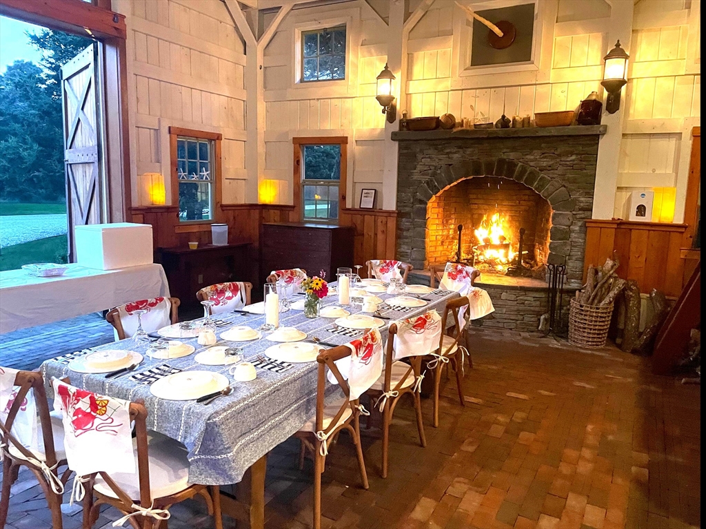1 Pochick Avenue Nantucket, MA 02554 - Photo 40 of 42 a view of a patio with table and chairs a barbeque with wooden floor
