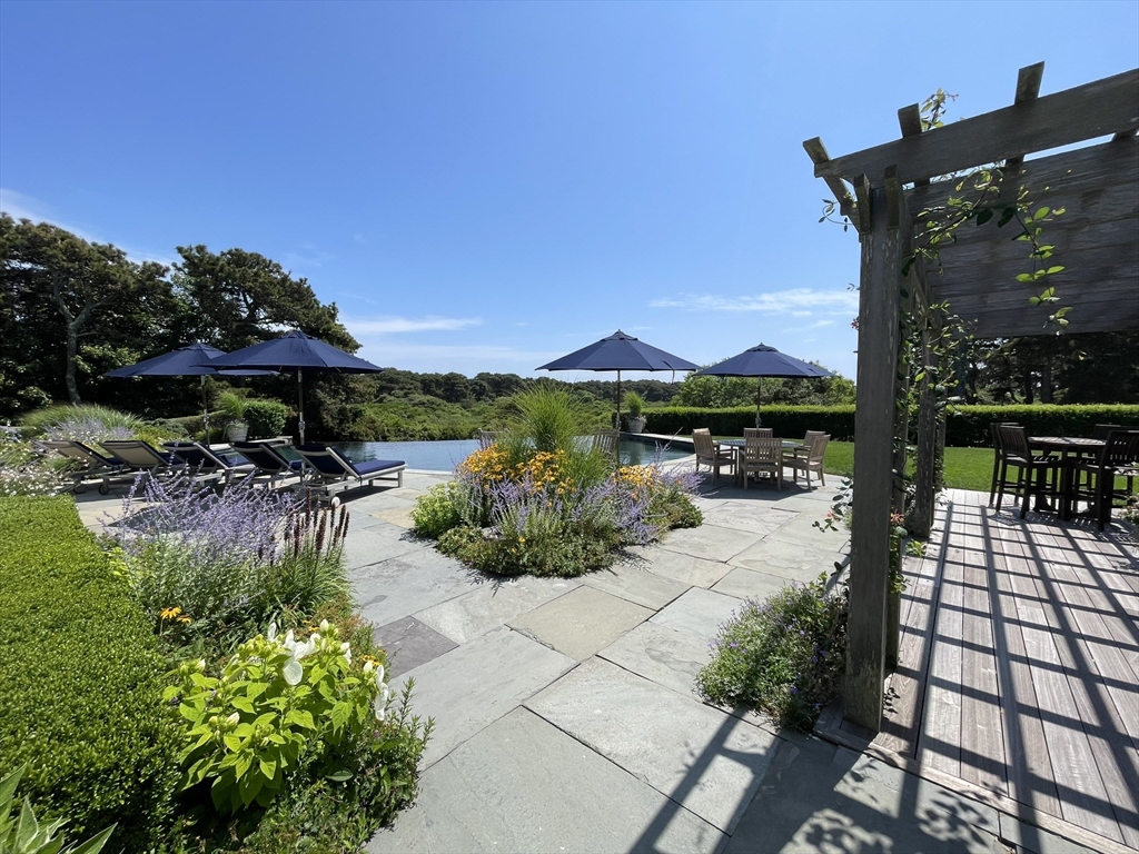 1 Pochick Avenue Nantucket, MA 02554 - Photo 4 of 42 a view of a patio with chairs and plants