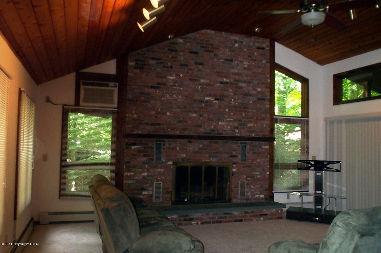 635 Decker Road Bushkill, PA 18324 - Photo 3 of 9 a living room with furniture and a fireplace