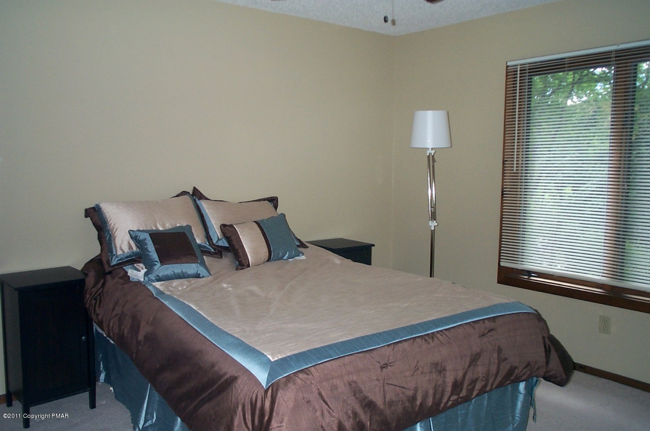 635 Decker Road Bushkill, PA 18324 - Photo 5 of 9 a bedroom with a bed and a window