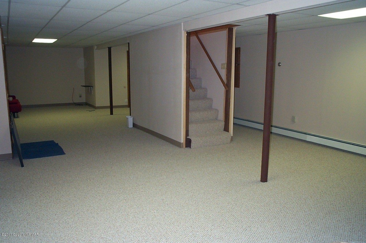 635 Decker Road Bushkill, PA 18324 - Photo 9 of 9 an empty room with sliding door