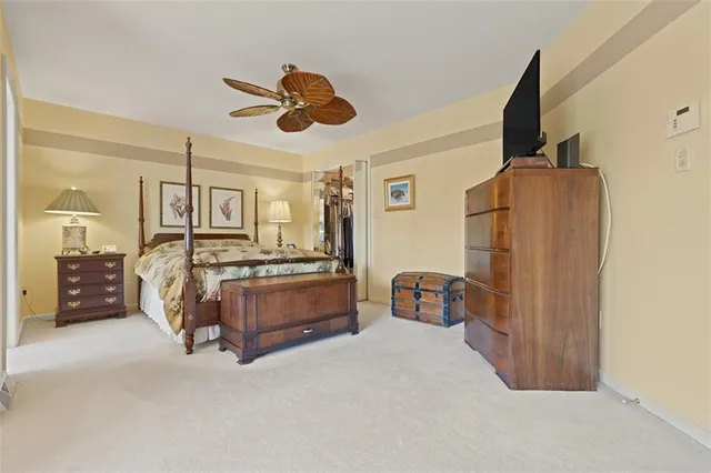 a bedroom with a bed and cabinets