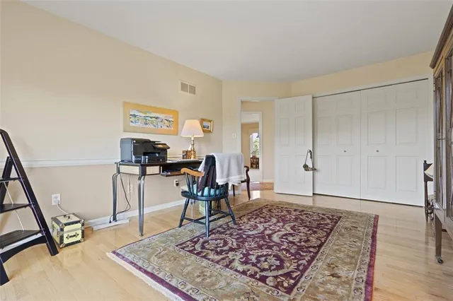 a living room with furniture a rug and a large window