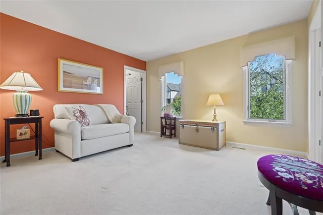 a living room with furniture and a sink