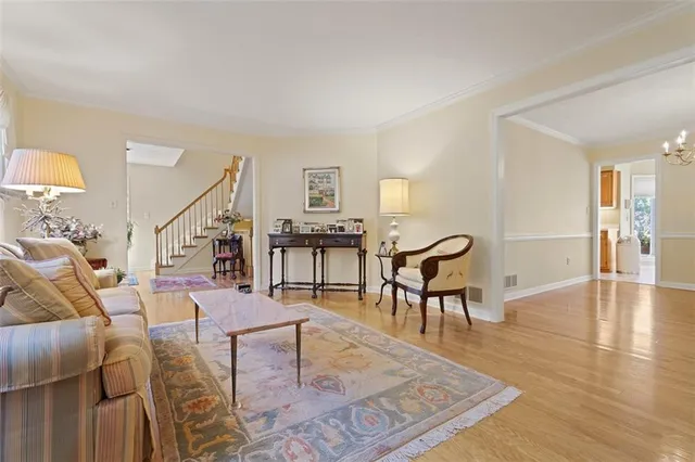 a living room with furniture and a table
