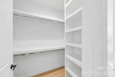 a view of an empty walk in closet