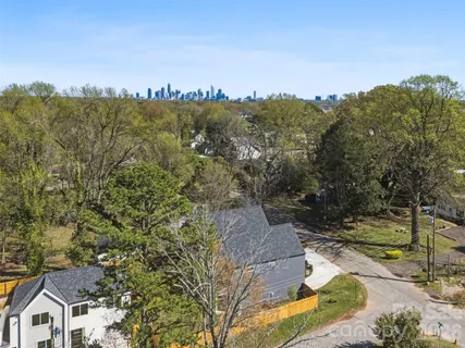 a view of a house with a yard and a mountain view