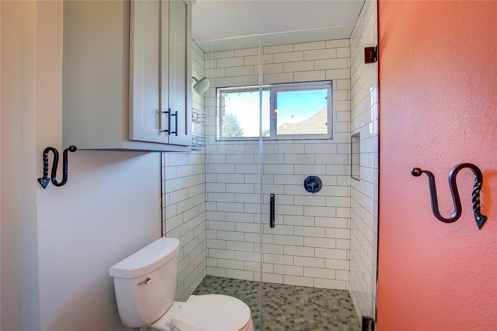 1157 Zajic Drive Terrell, TX 75160 - Photo 32 of 39 Full bathroom featuring a shower stall and a textured wall
