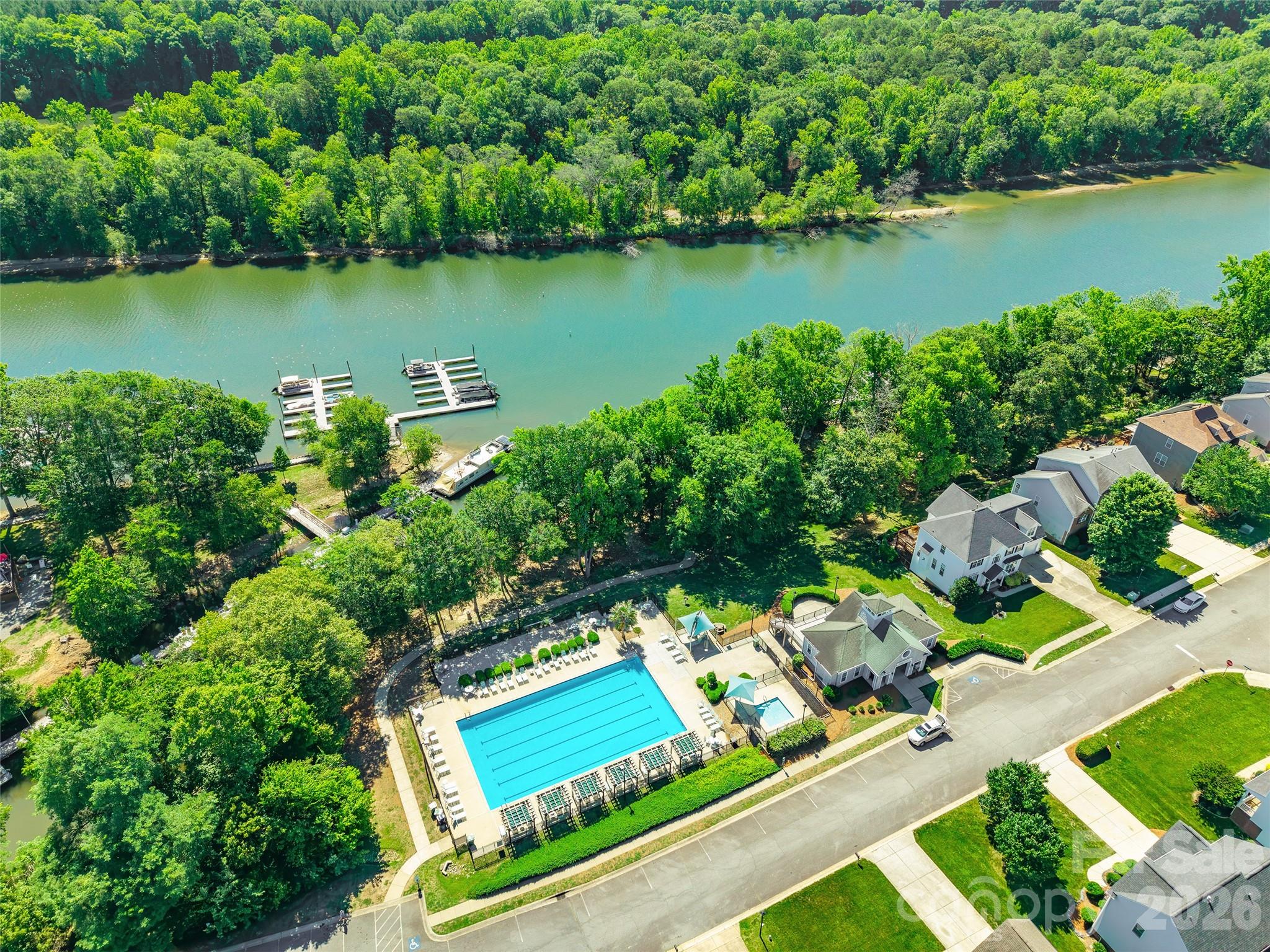 104 Rock Ridge Lane Mount Holly, NC 28120 - Photo 45 of 48 an aerial view of lake residential house with outdoor space and trees