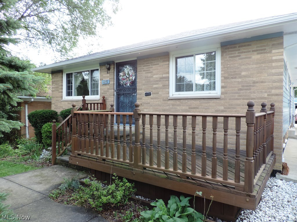 435 Center Road Bedford, OH 44146 - Photo 24 of 25 Front of the home also with nice deck for evening relaxing and watching the seasons change...This home has it all! Welcome home to 435 Center Road. Violation Free and ready for you to move into!