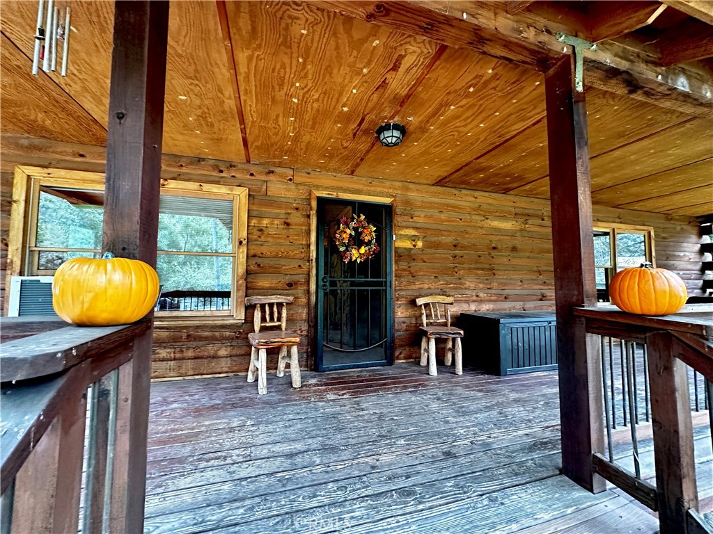 a view of a lobby with a door and wooden floor