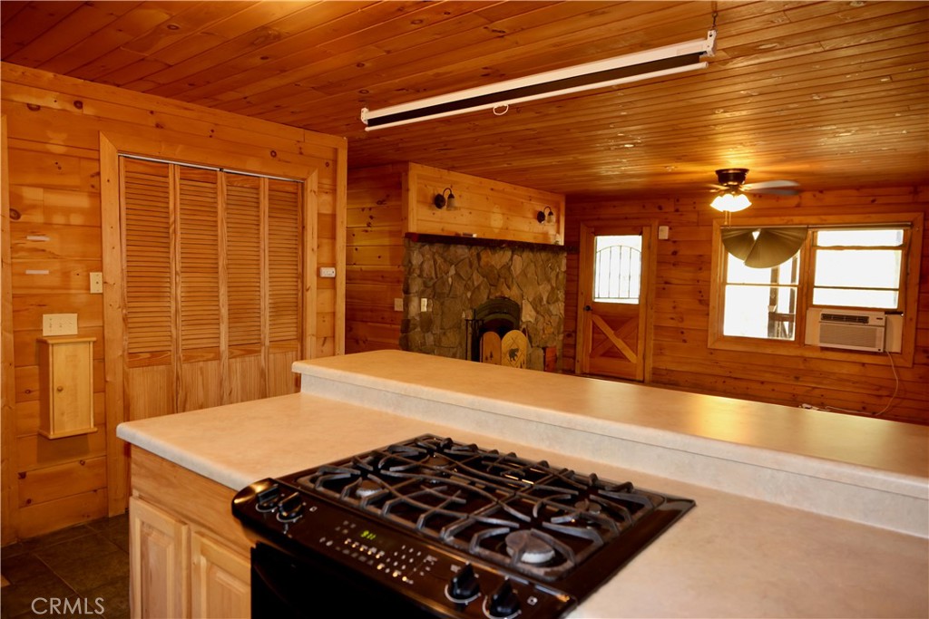 37023 Alder Drive Yucaipa, CA 92399 - Photo 13 of 34 a kitchen with a stove and a refrigerator