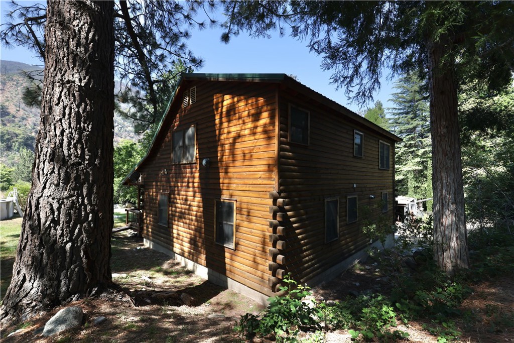 37023 Alder Drive Yucaipa, CA 92399 - Photo 24 of 34 a view of a house with a yard