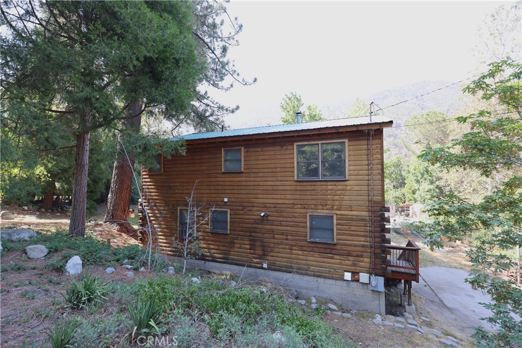 37023 Alder Drive Yucaipa, CA 92399 - Photo 25 of 34 a view of a house with a yard