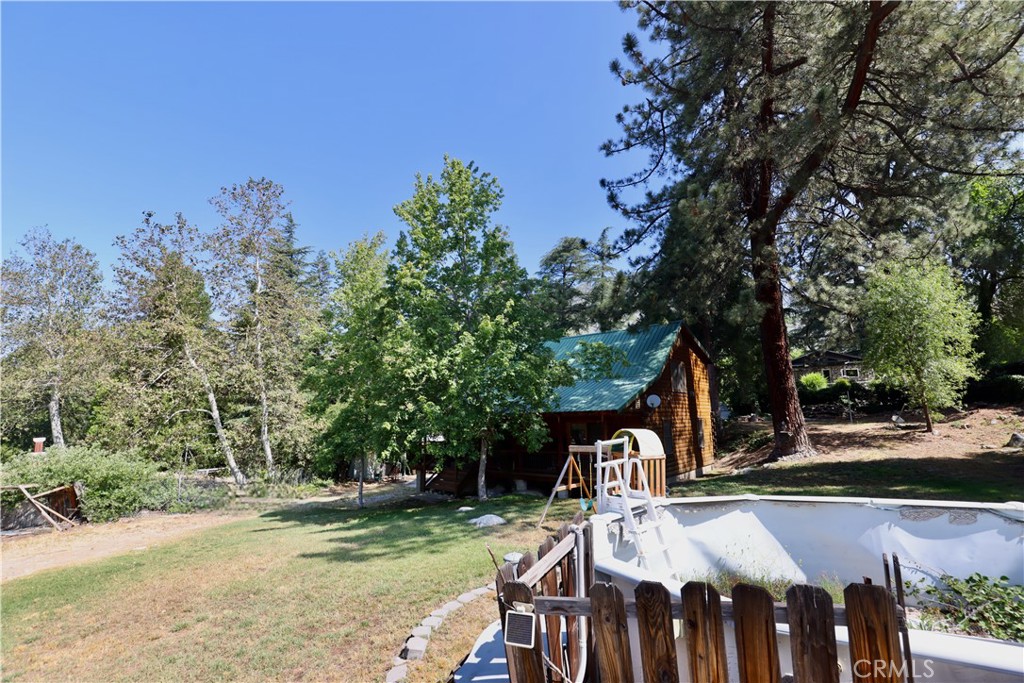 37023 Alder Drive Yucaipa, CA 92399 - Photo 26 of 34 a view of a chairs and table in the patio