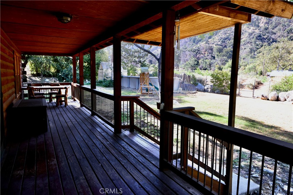 37023 Alder Drive Yucaipa, CA 92399 - Photo 30 of 34 a view of a balcony with wooden floor