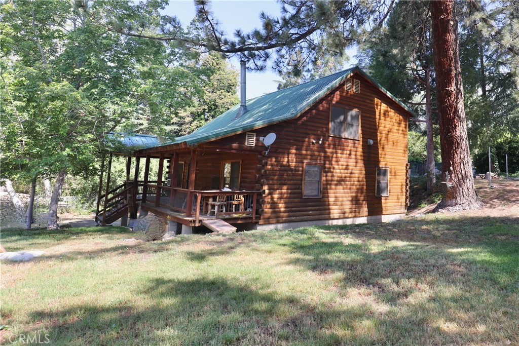 37023 Alder Drive Yucaipa, CA 92399 - Photo 3 of 34 a view of a house with a yard and sitting area