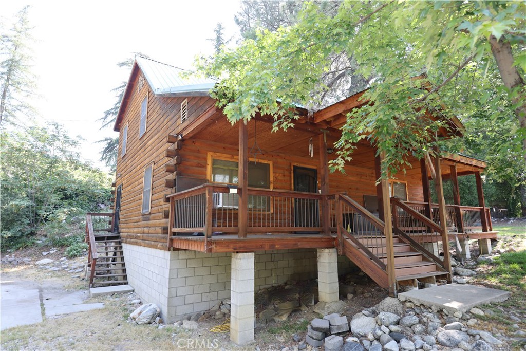 37023 Alder Drive Yucaipa, CA 92399 - Photo 6 of 34 a front view of a house with a yard