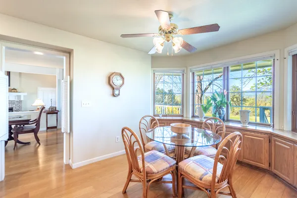 a view of kitchen with furniture and wooden floor