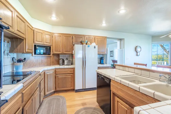 a large bedroom with a bed and a cabinets