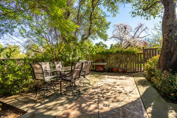 a view of a deck with table and chairs and wooden floor