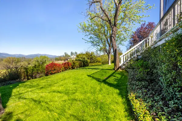 a living room filled with furniture window and wooden floor