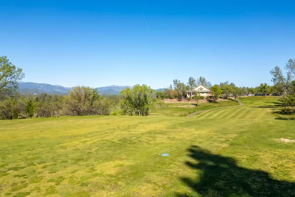 a view of balcony with chairs and wooden fence