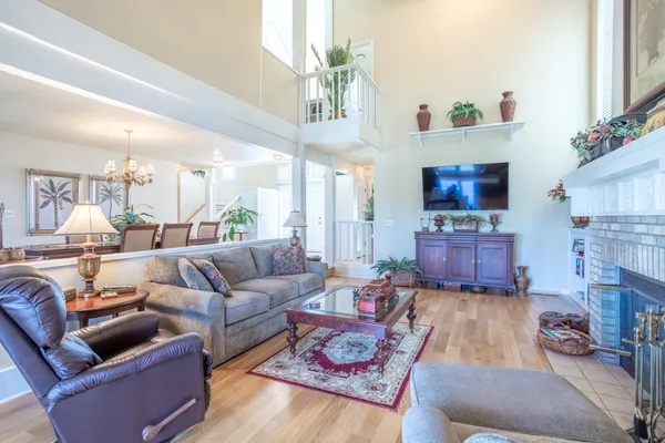 a living room with furniture or couch and a wooden floor