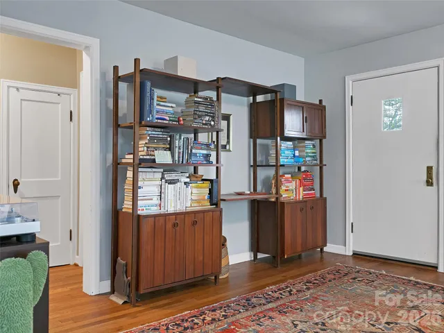 a room with refrigerator and cabinets
