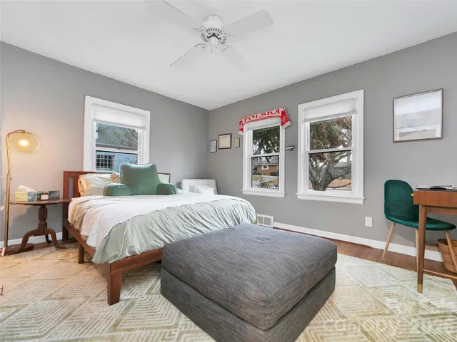 a bedroom with a large bed and a window