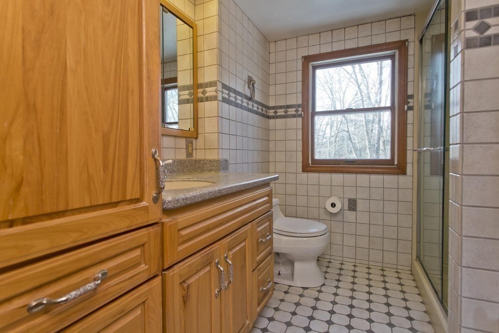 200 Town Farm Road Monson, MA 01057 - Photo 13 of 42 a bathroom with a sink a toilet and shower
