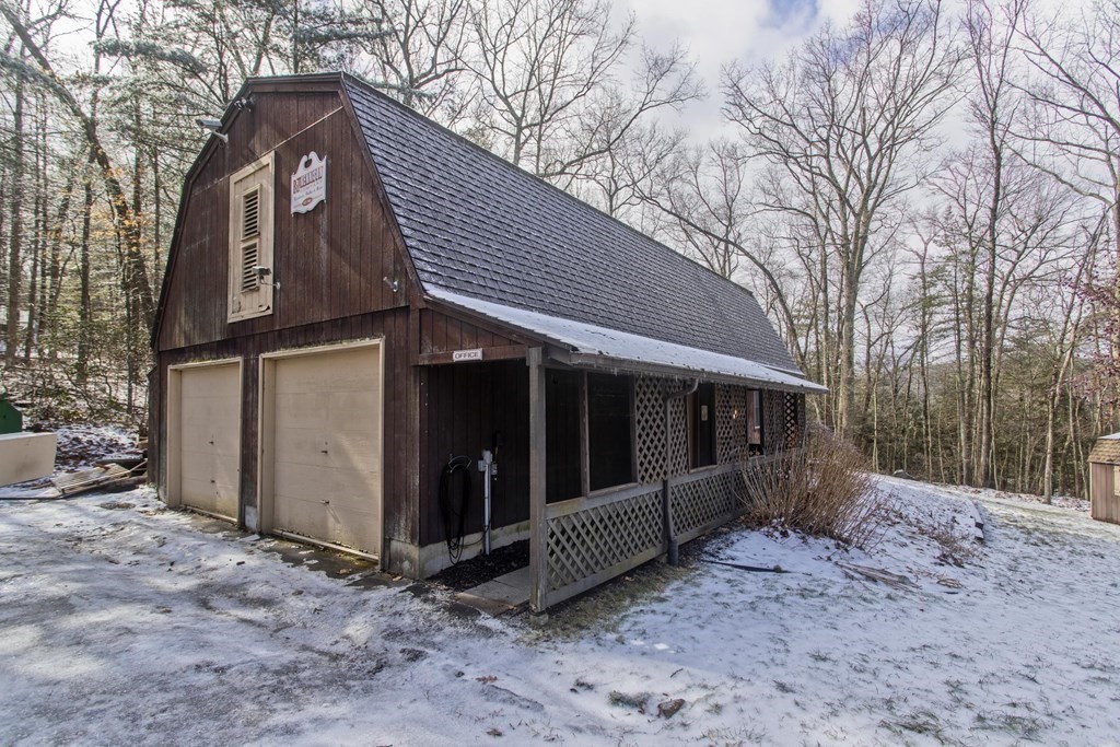 200 Town Farm Road Monson, MA 01057 - Photo 2 of 42 a view of a house with a large tree and wooden fence