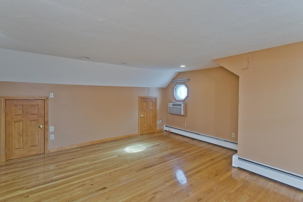 200 Town Farm Road Monson, MA 01057 - Photo 27 of 42 an empty room with wooden floor and windows