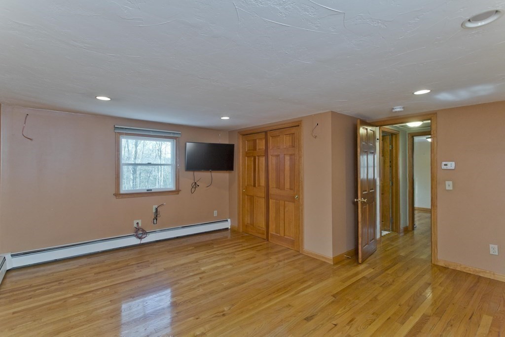 200 Town Farm Road Monson, MA 01057 - Photo 28 of 42 a view of an empty room with wooden floor and a window