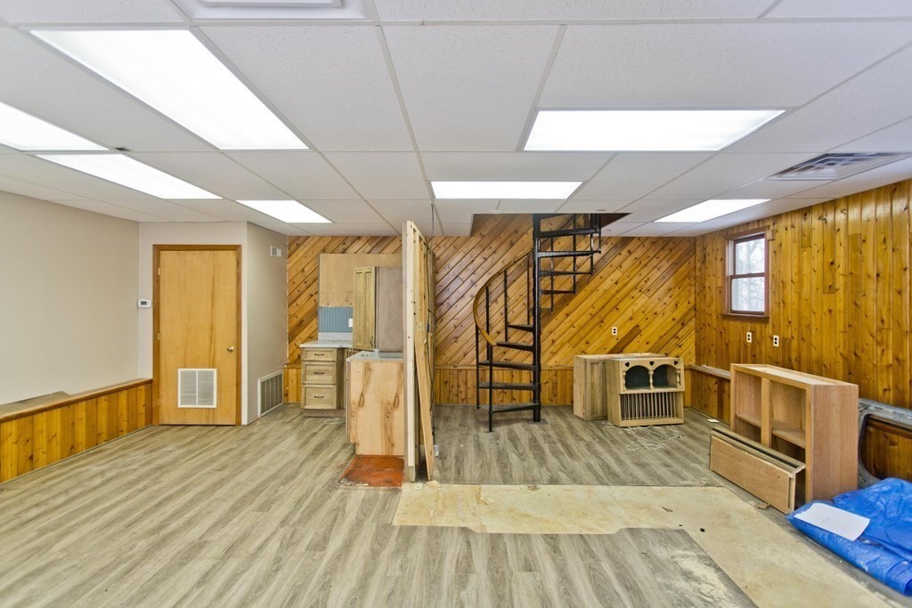 200 Town Farm Road Monson, MA 01057 - Photo 35 of 42 a view of empty room with wooden floor and windows