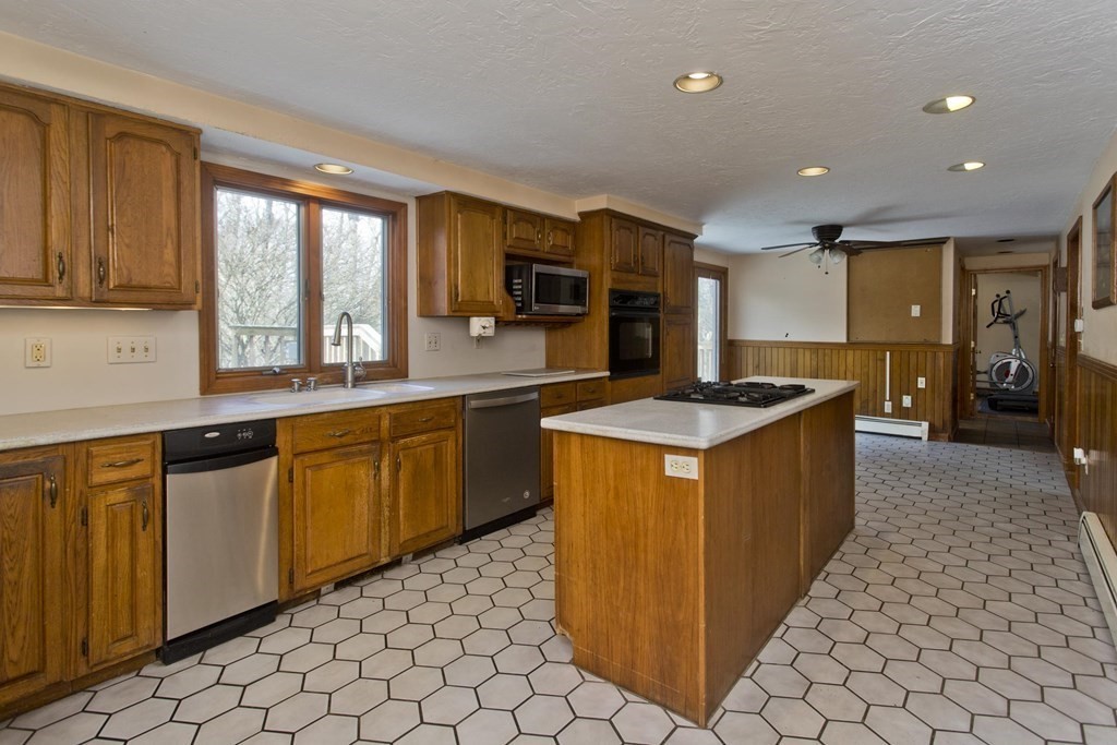 200 Town Farm Road Monson, MA 01057 - Photo 4 of 42 a kitchen with stainless steel appliances granite countertop a sink counter space cabinets and a large window