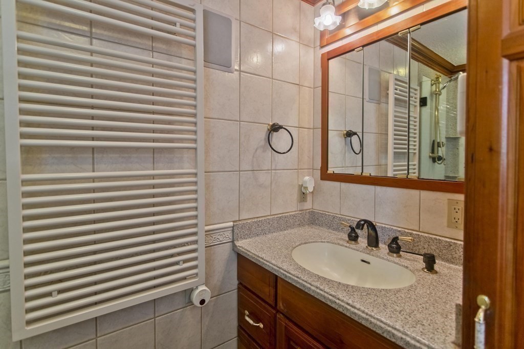 200 Town Farm Road Monson, MA 01057 - Photo 10 of 42 a bathroom with a sink and a mirror