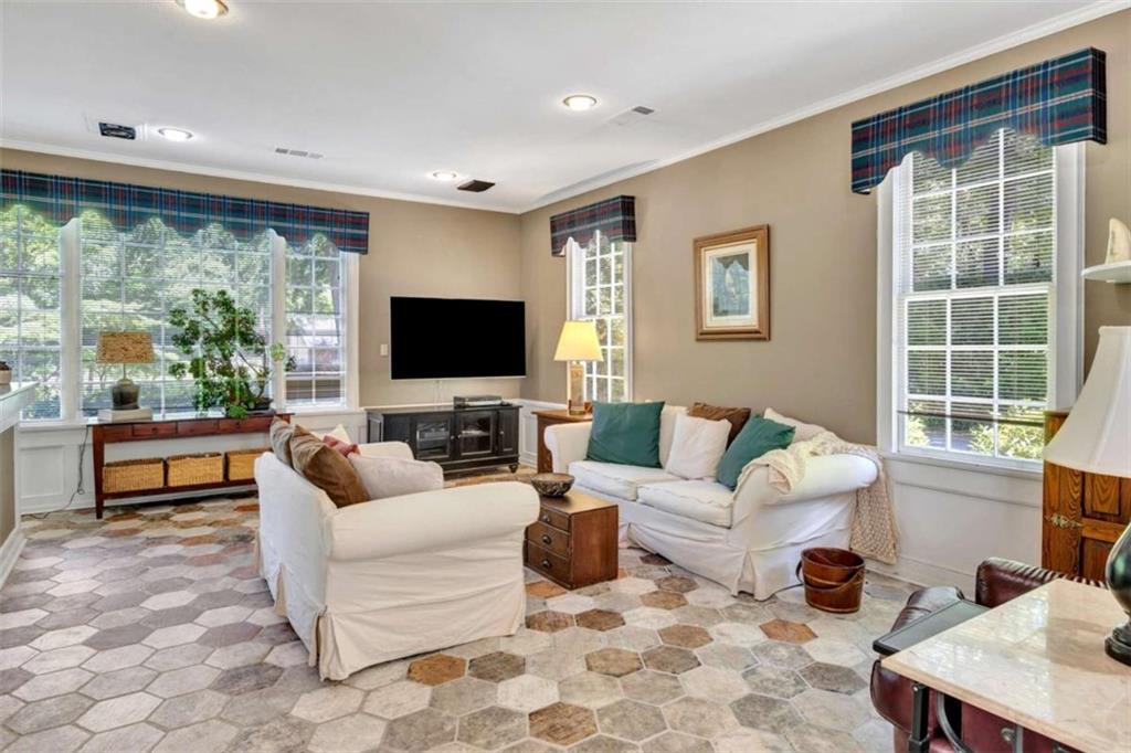 103 Gabriel Way Social Circle, GA 30025 - Photo 27 of 70 a living room with furniture and a flat screen tv