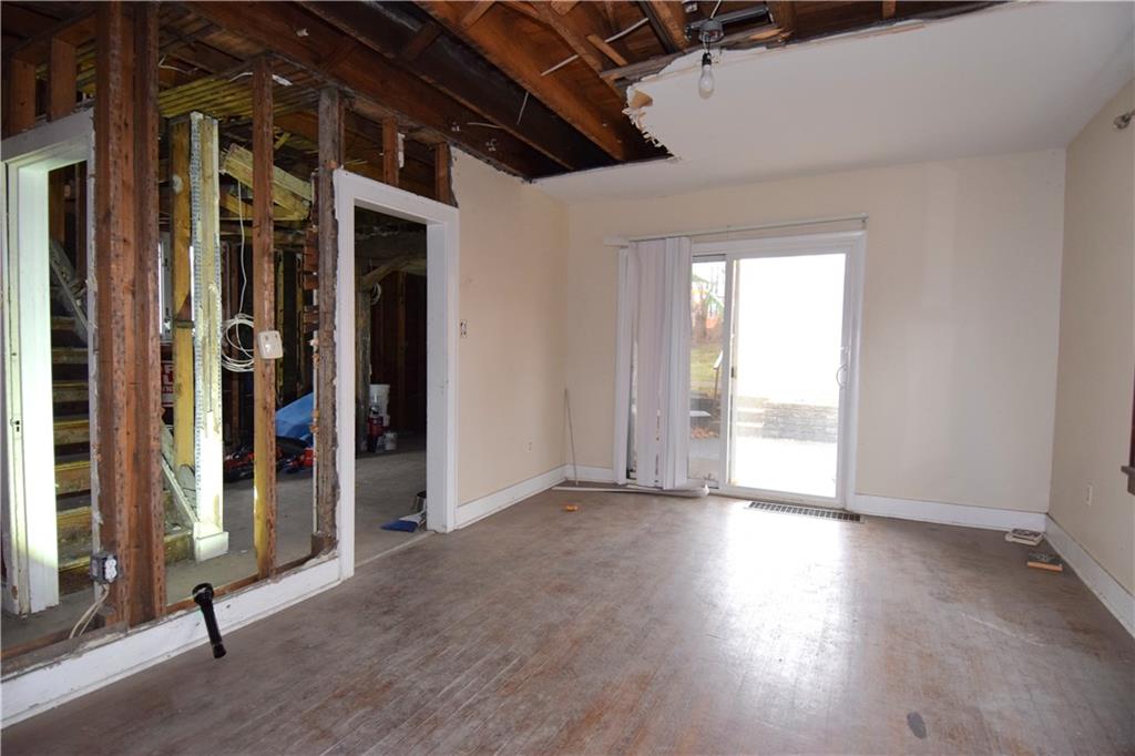 621 Watson Street Coraopolis, PA 15108 - Photo 11 of 32 an empty room with wooden floor and windows