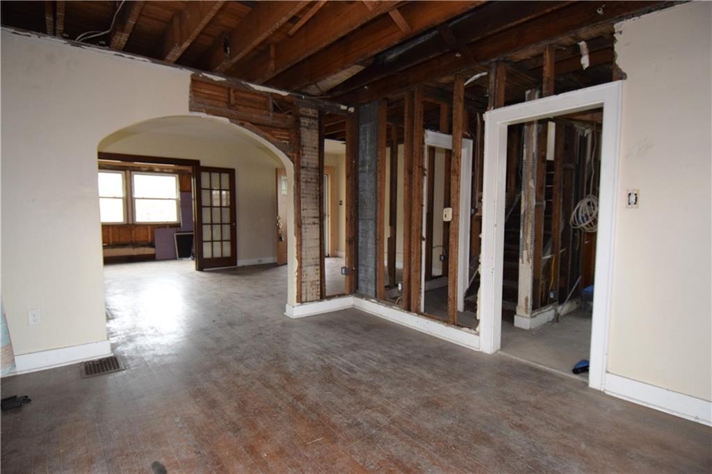 621 Watson Street Coraopolis, PA 15108 - Photo 12 of 32 a view of a hallway with wooden walls and windows