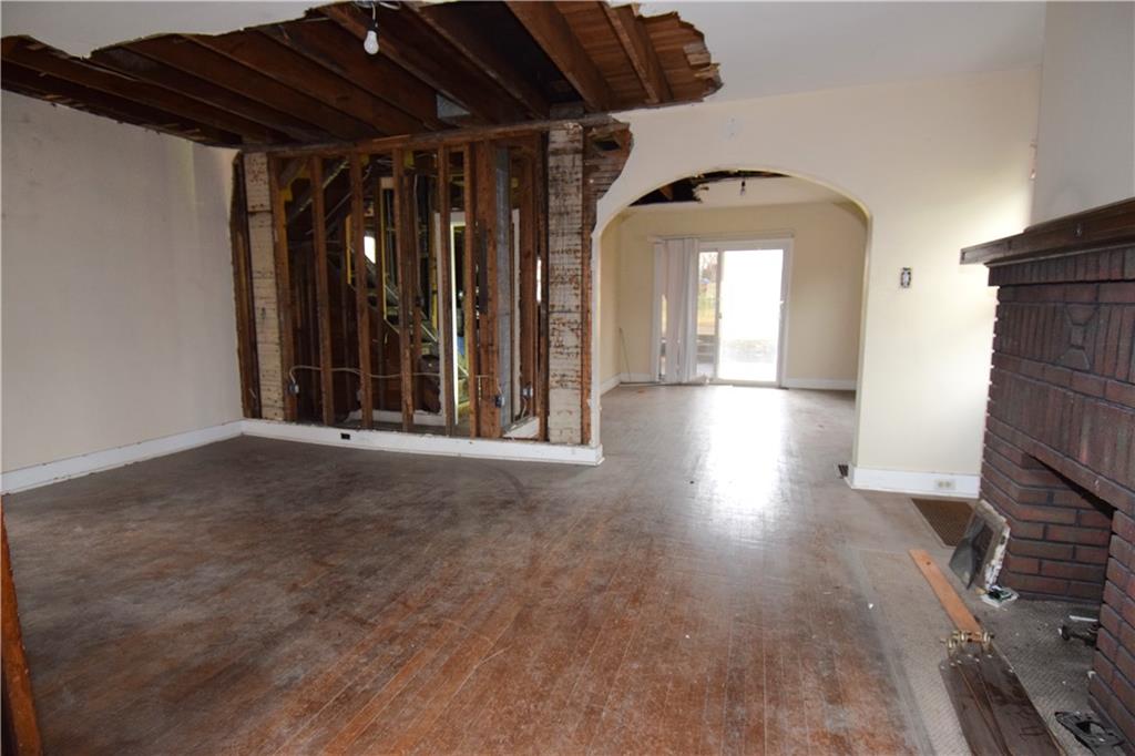 621 Watson Street Coraopolis, PA 15108 - Photo 9 of 32 a view of empty room with wooden floor and fan