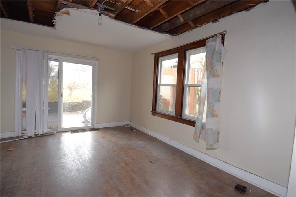 621 Watson Street Coraopolis, PA 15108 - Photo 10 of 32 an empty room with wooden floor and windows