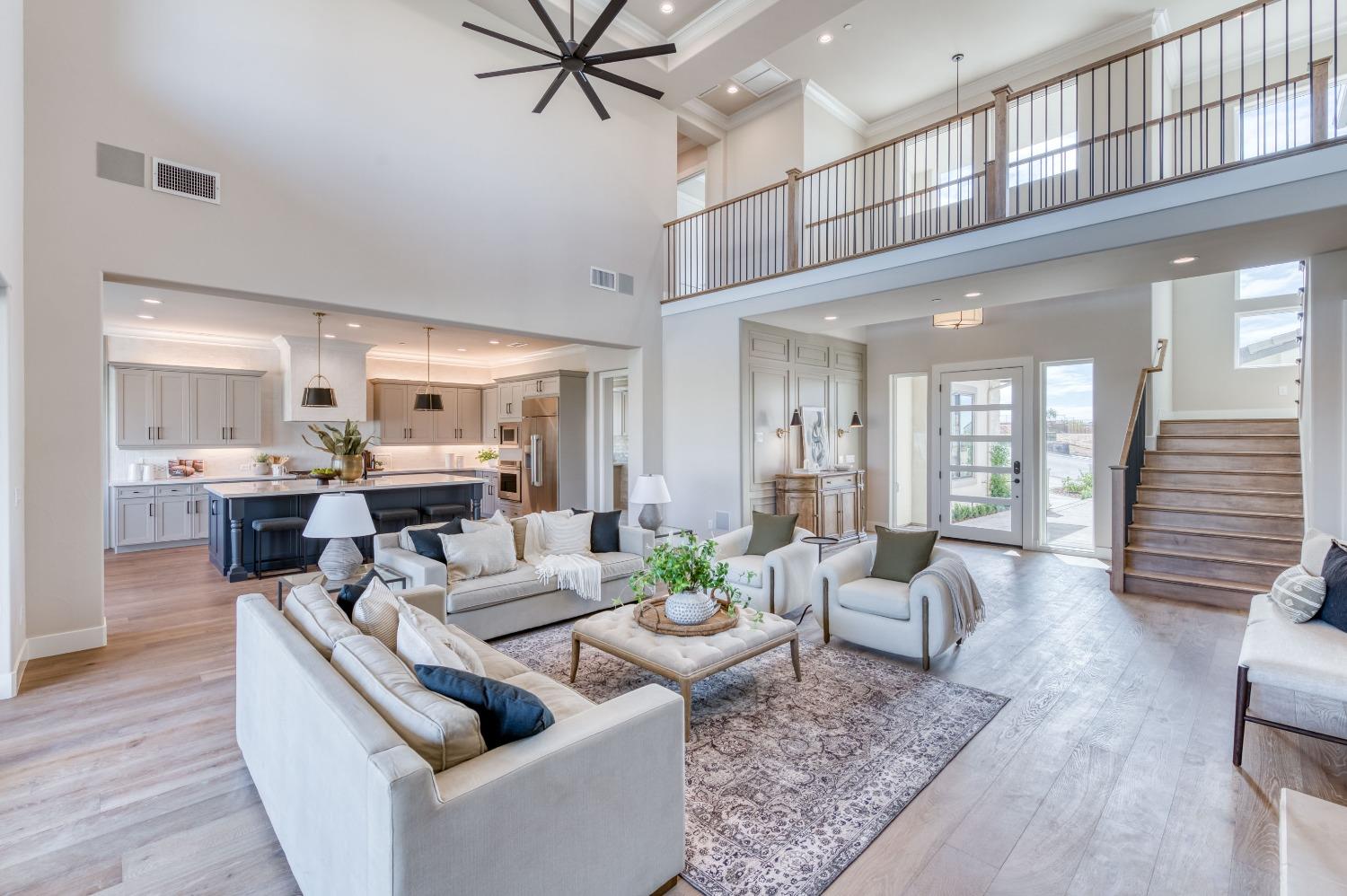 881 Terrace Place Madera, CA 93636 - Photo 15 of 85 a living room with furniture wooden floor and a chandelier