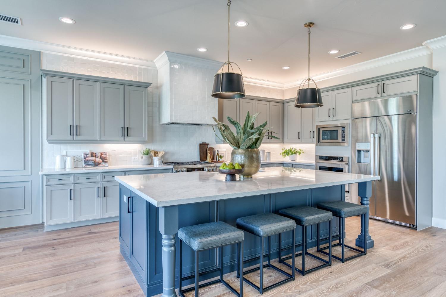 881 Terrace Place Madera, CA 93636 - Photo 19 of 85 a kitchen with stainless steel appliances granite countertop a sink refrigerator and cabinets