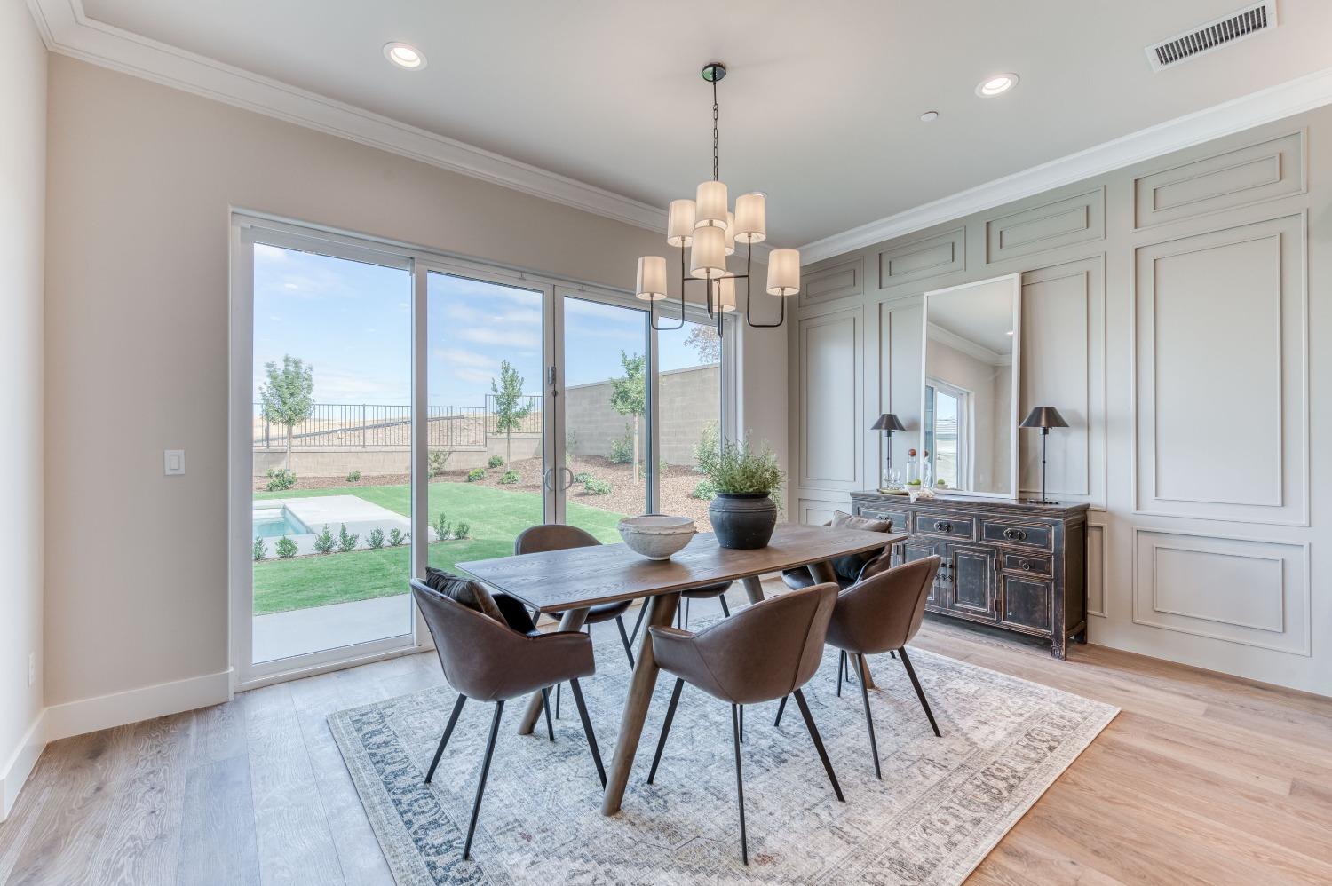 881 Terrace Place Madera, CA 93636 - Photo 22 of 85 a view of a dining room with furniture window and wooden floor